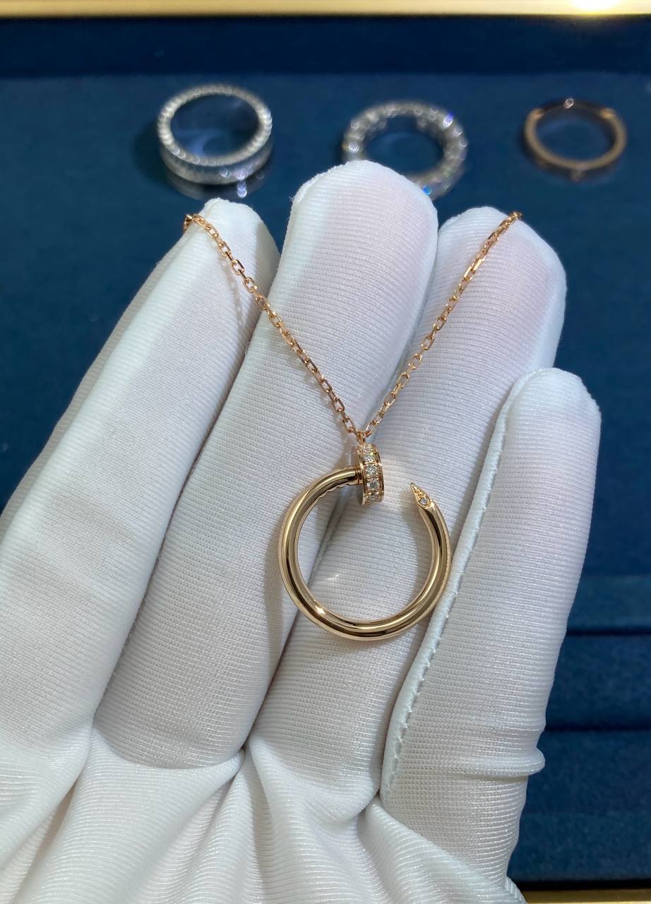 Nail pendant with diamonds