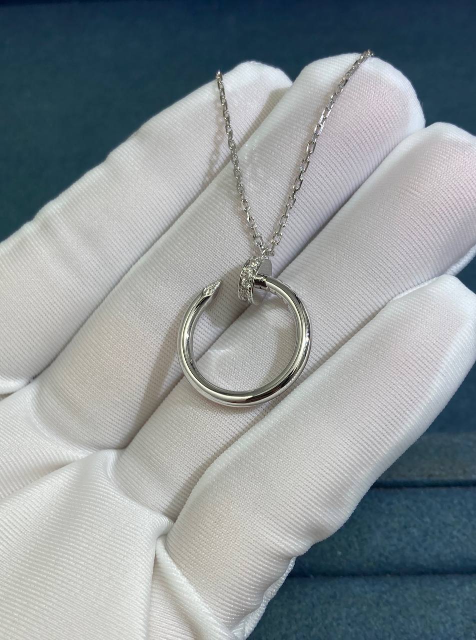 Nail pendant with diamonds