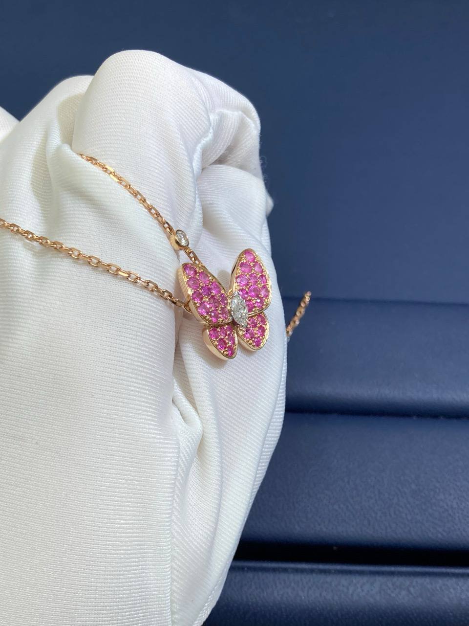 VC butterfly pendant with 2 diamonds and pink sapphires