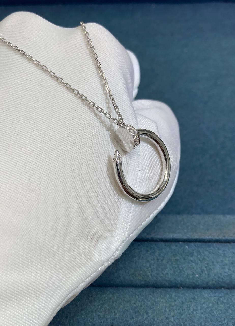 Nail pendant with diamonds