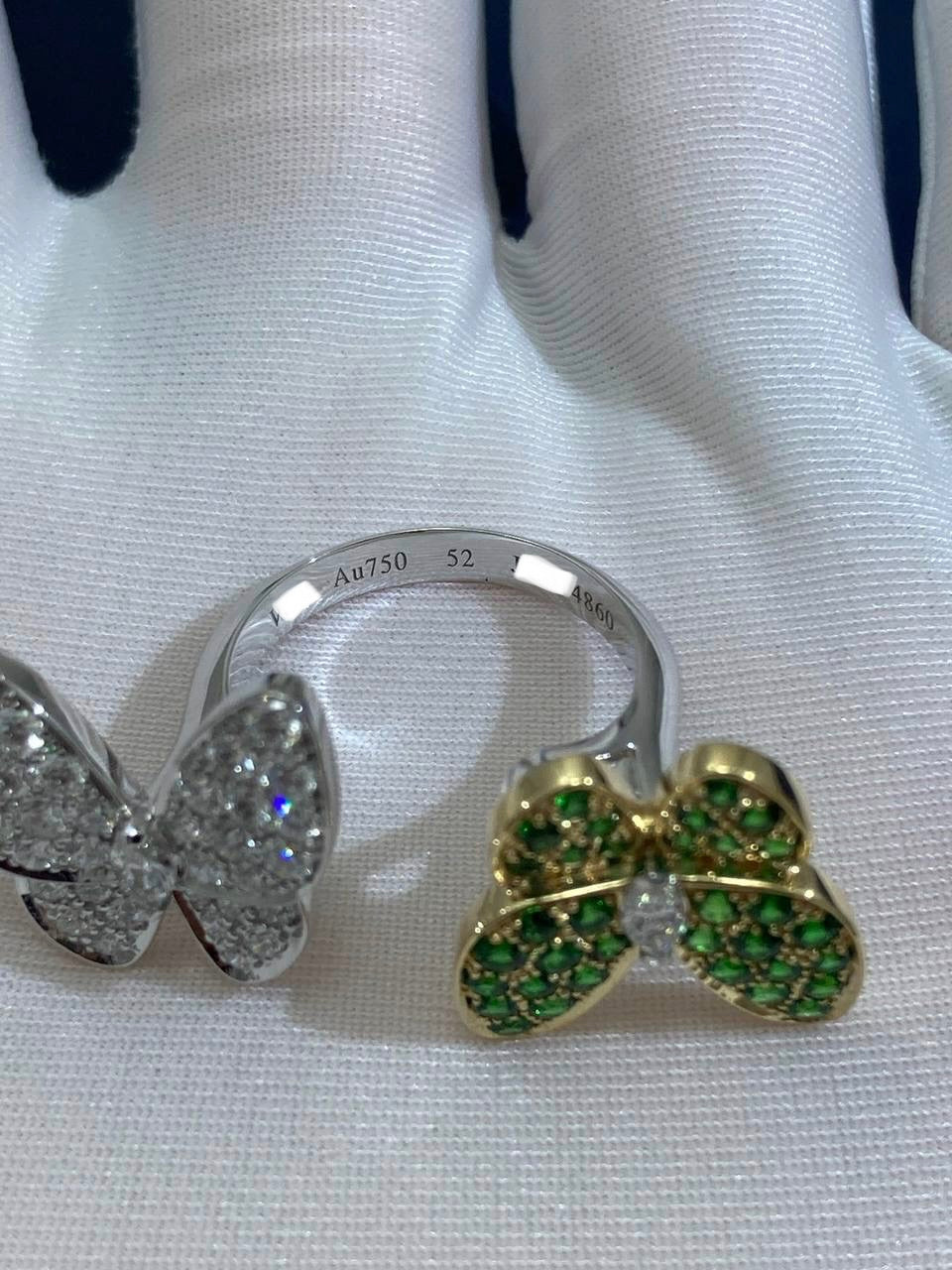 VC between the finger butterfly ring with diamonds and tsavorites