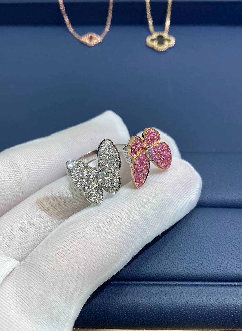VC between the finger butterfly ring with diamonds and pink sapphires