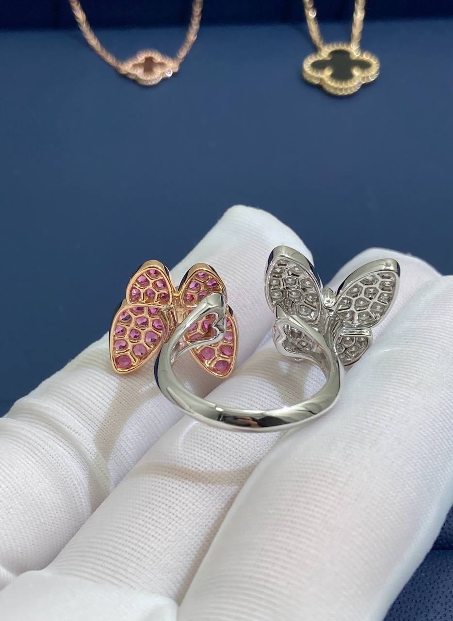 VC between the finger butterfly ring with diamonds and pink sapphires