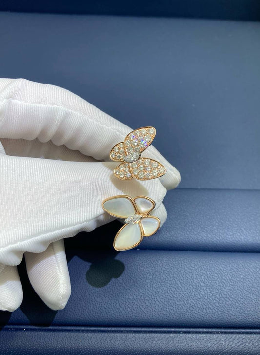 VC between the finger butterfly ring with Mother-of-Pearl and diamonds