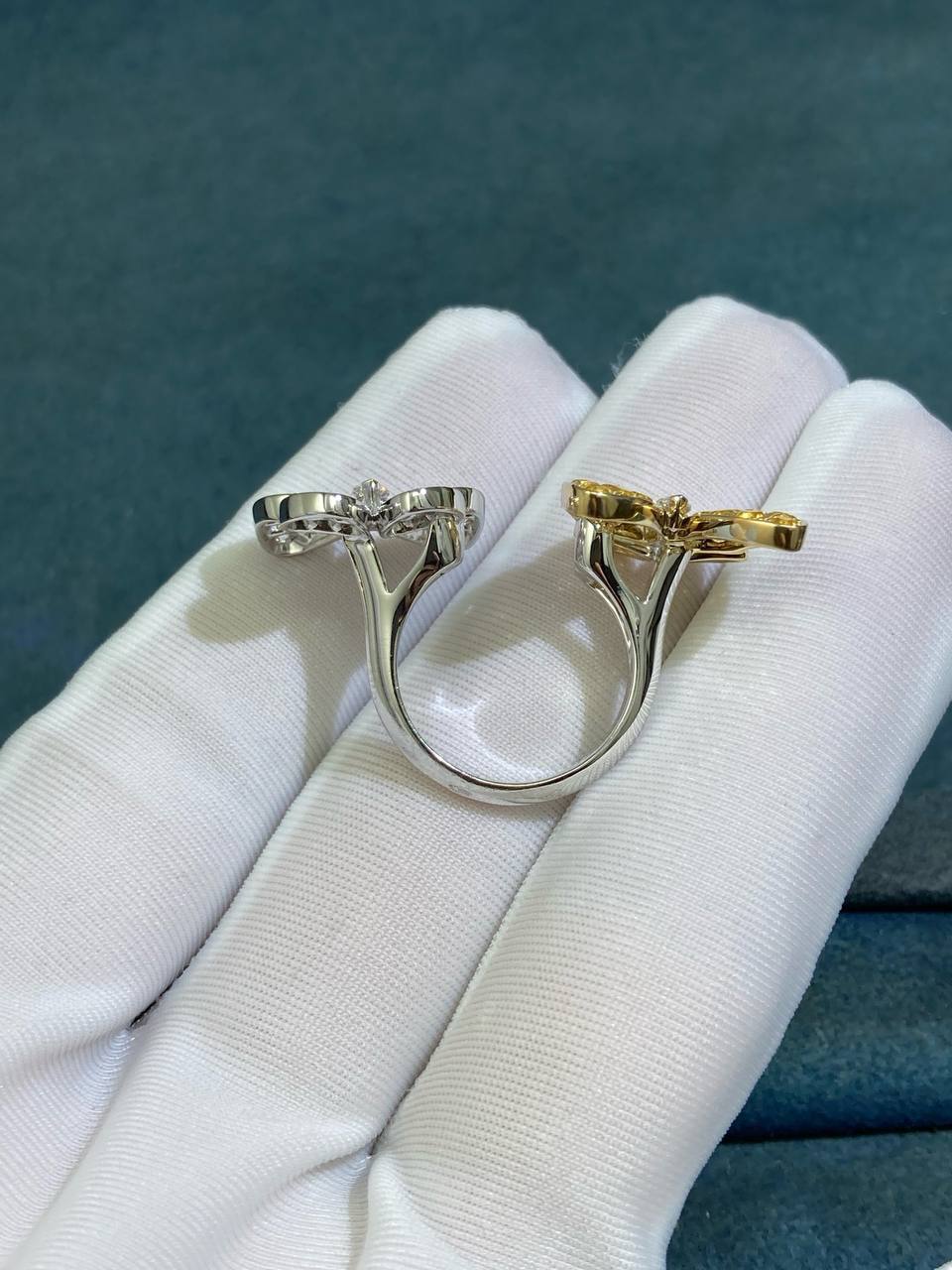 VC between the finger butterfly ring with diamonds and yellow sapphires