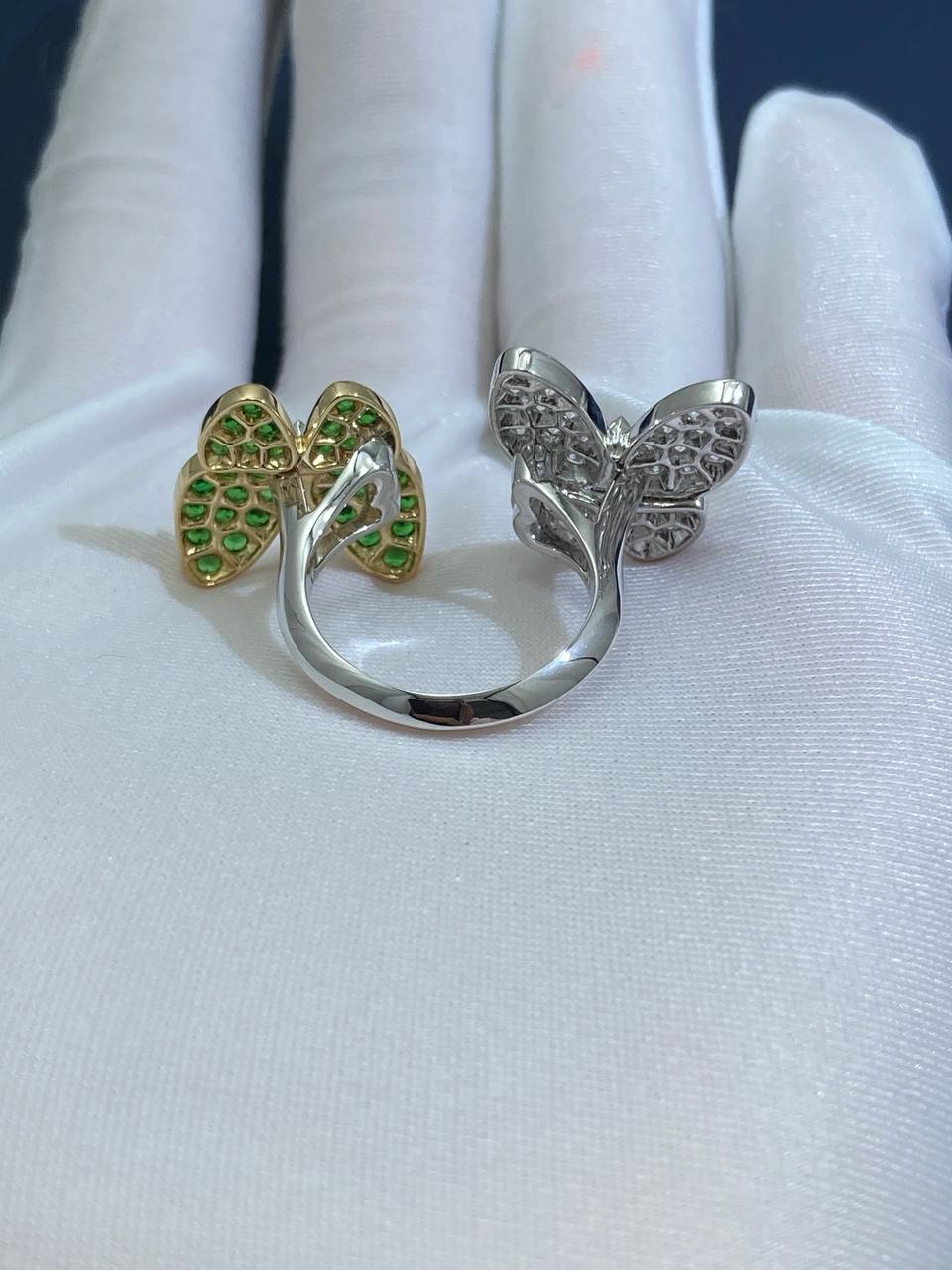 VC between the finger butterfly ring with diamonds and tsavorites