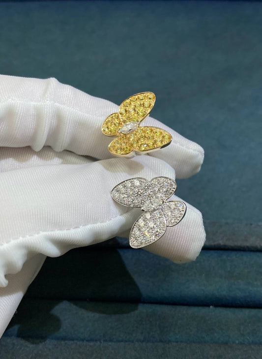 VC between the finger butterfly ring with diamonds and yellow sapphires
