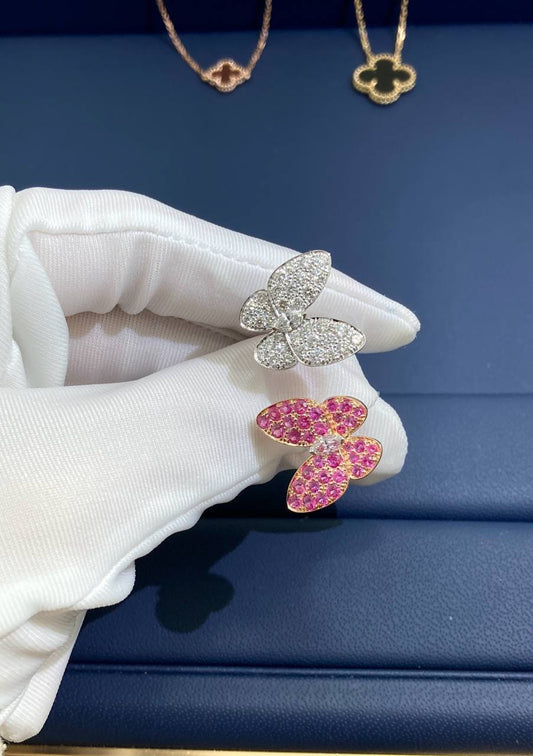 VC between the finger butterfly ring with diamonds and pink sapphires