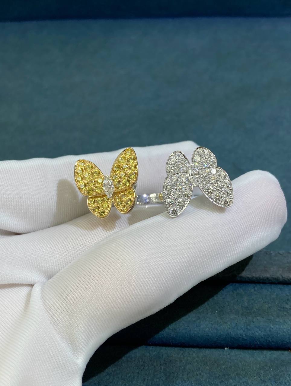 VC between the finger butterfly ring with diamonds and yellow sapphires