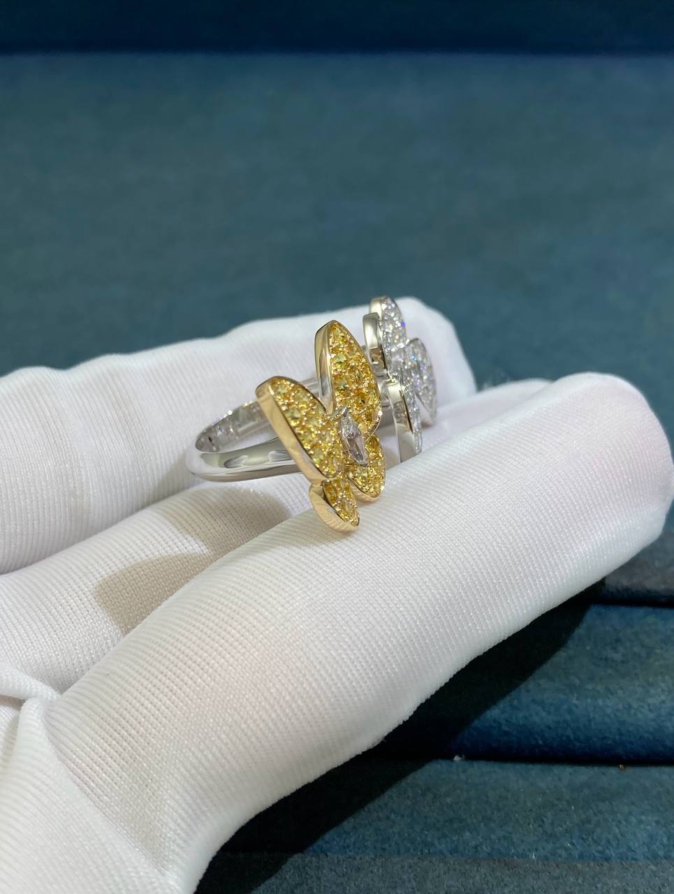 VC between the finger butterfly ring with diamonds and yellow sapphires