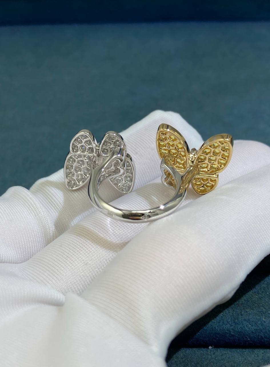 VC between the finger butterfly ring with diamonds and yellow sapphires