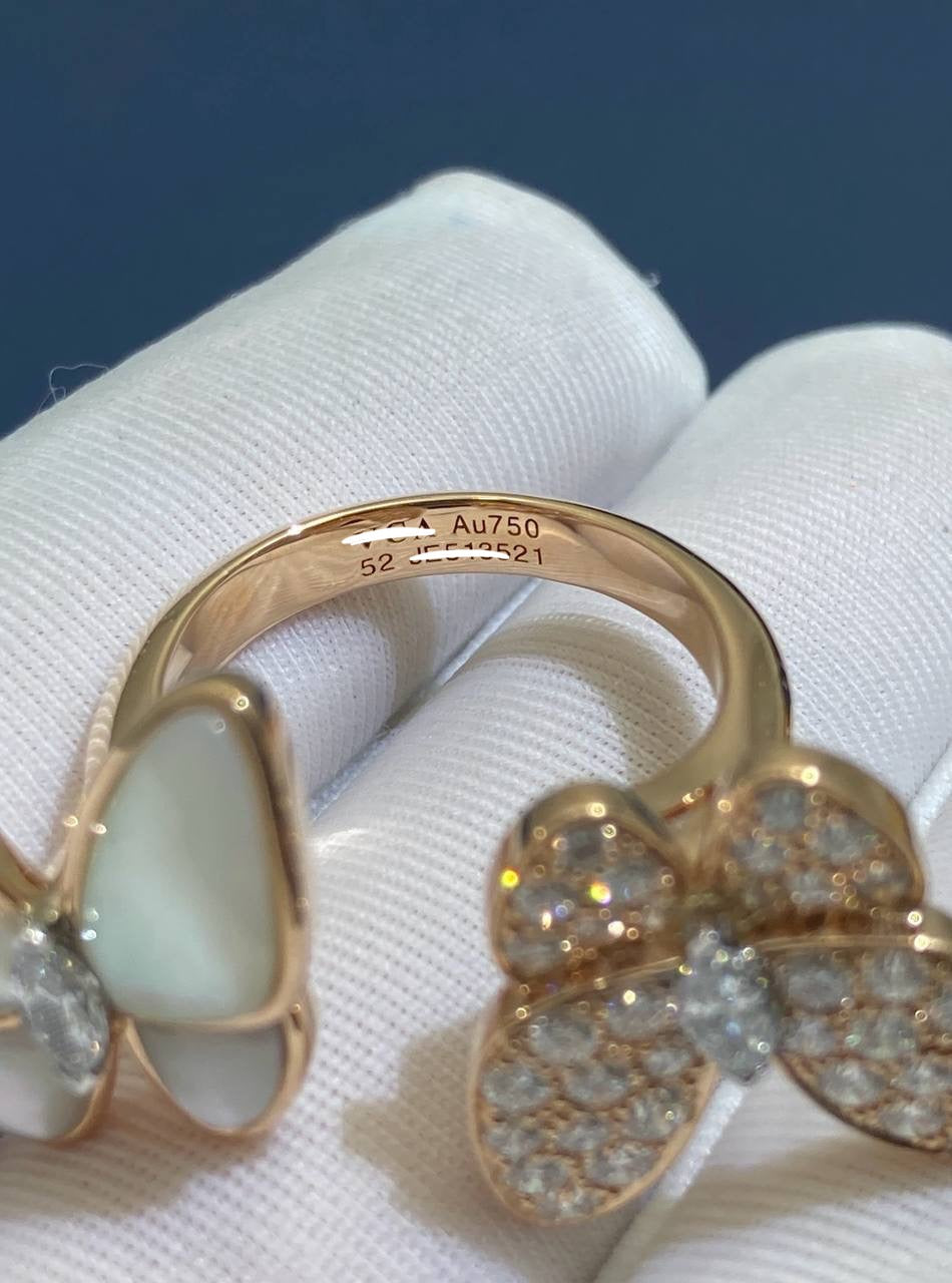 VC between the finger butterfly ring with Mother-of-Pearl and diamonds