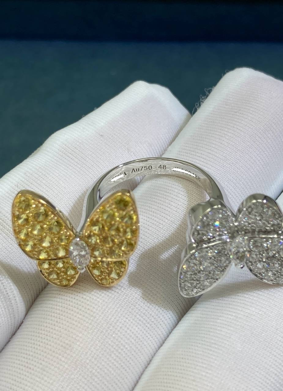 VC between the finger butterfly ring with diamonds and yellow sapphires