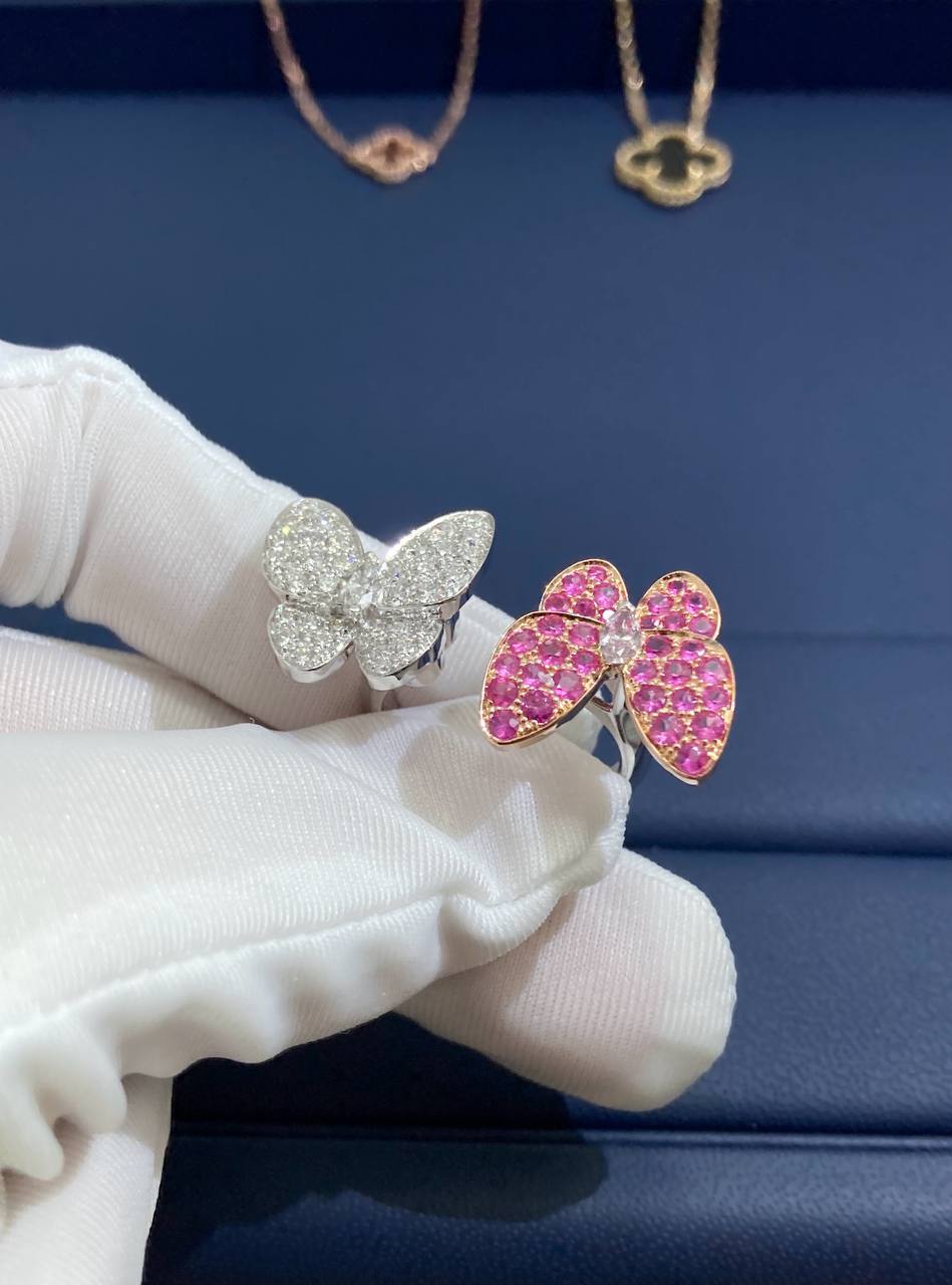 VC between the finger butterfly ring with diamonds and pink sapphires