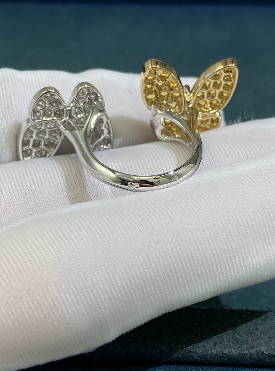 VC between the finger butterfly ring with diamonds and yellow sapphires